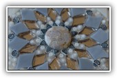 Mother of Pearl Mirror: 
Made of enamel, glass art, mirrored glass, murrine, gold and glass pearls, mother of pearl and agate on a wooden rounded base 
Size 60x60 cm board 12cm. Also custom made.
