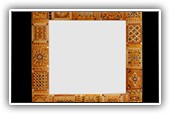 Mirror 'bonzo':   
Made of art glass, mirrored glass, murrine, gold and glass pearls on a curved wooden board
Size 50x50 cm border 8.5 cm. Also custom made
